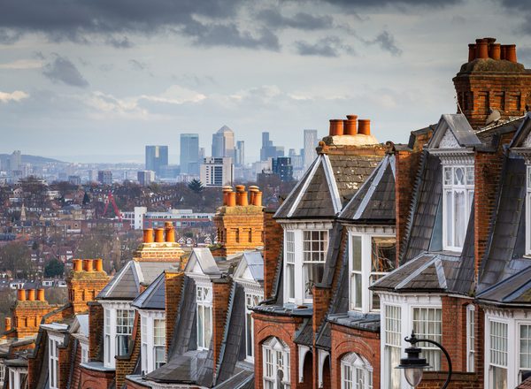 A row of red brick Victorian houses with panoramic views across to the skyscrapers and financial district of the city of London