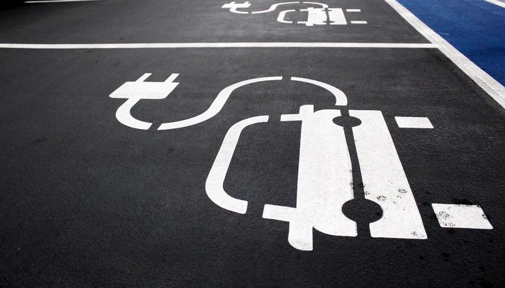 A car park with a series of electric vehicle charging point parking spaces