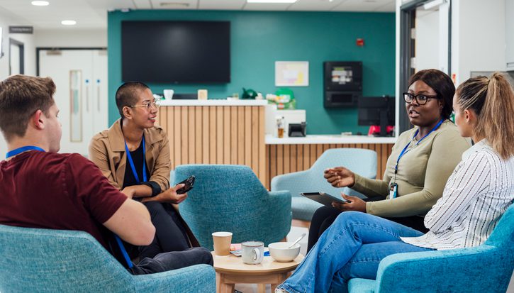 A group of healthcare professionals sitting in a staff common room in a hospital in Newcastle