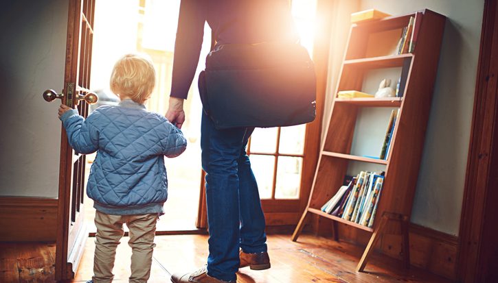 Door, leaving or back with parent and child in home together for goodbye or start of morning. Entrance, family or holding hands with person and kid in apartment for travel to school or business