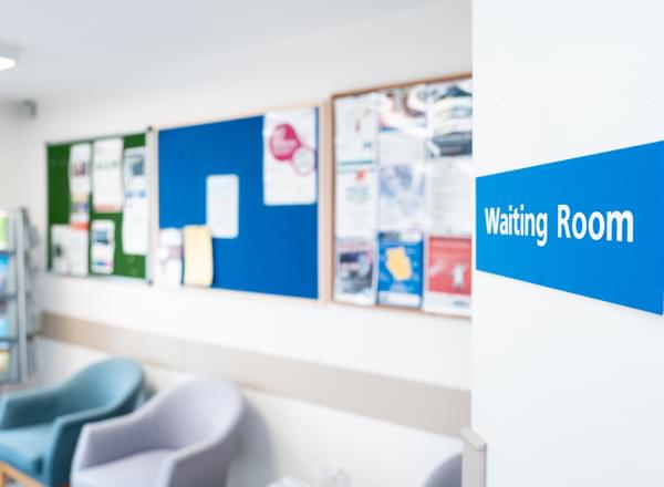 NHS hospital waiting room sign seen in a British hospital