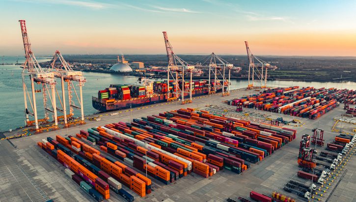 Shipping containers at Port of Southampton captured by drone at sunrise