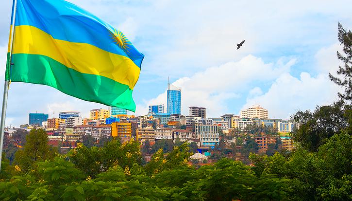 Rwanda flag with Kigali skyline in background